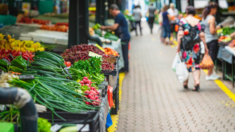 Various stalls and walkway at farmers market
