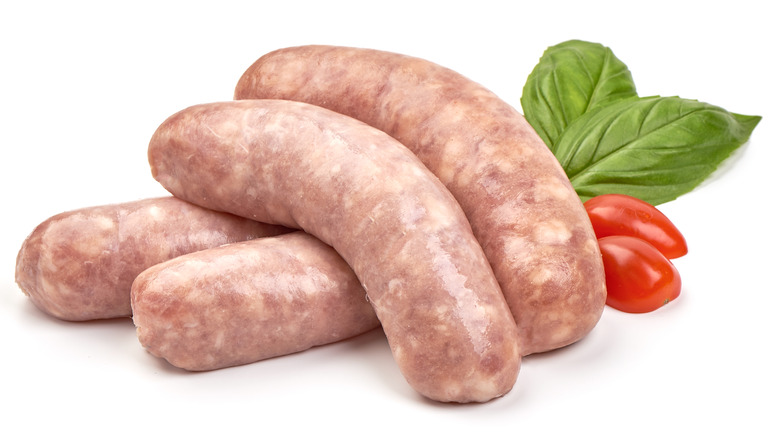 raw italian sausages with basil