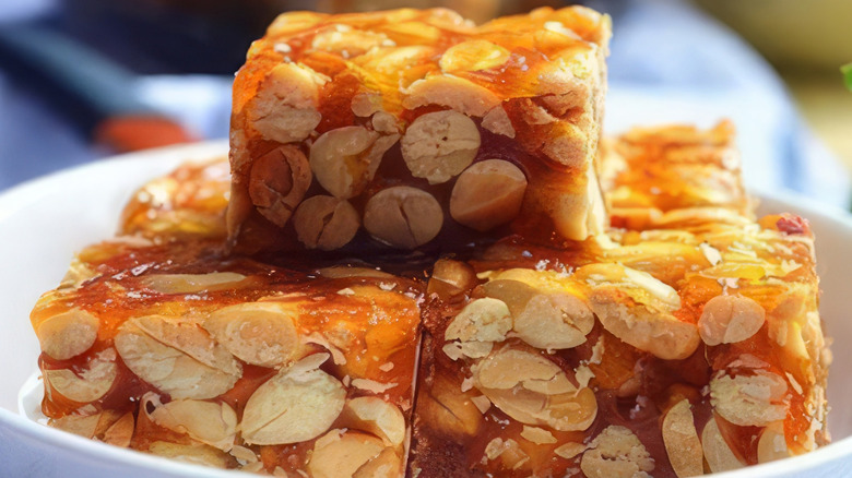 stack of thick peanut brittle on a plate