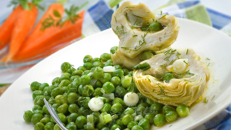 A plate of peas and artichokes