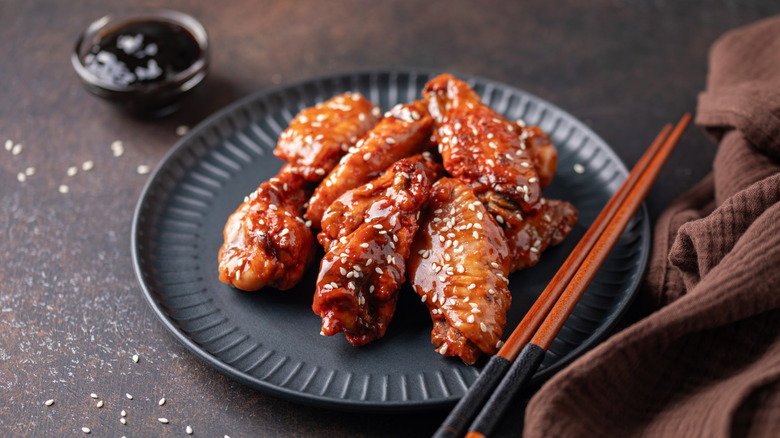 Glazed wings with chopsticks