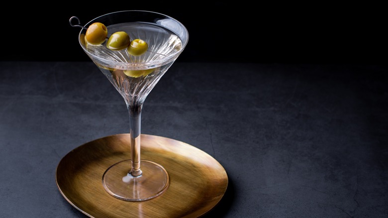 Martini with olives on a bronze platter