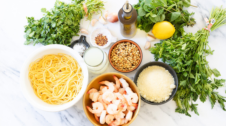 Ingredients for mixed herb pesto shrimp pasta