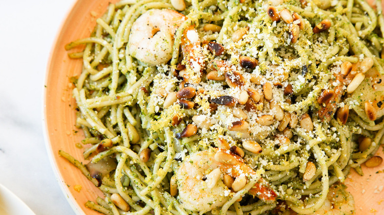 Pasta and shrimp on a plate.