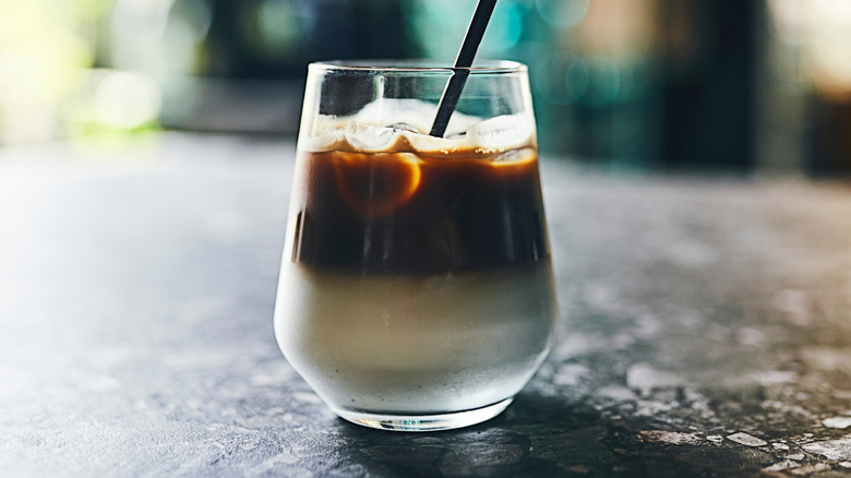 Layered iced latte with rum in a short glass