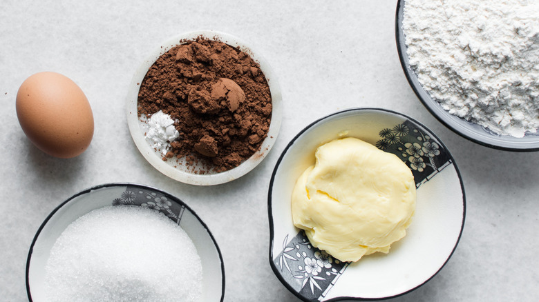 Chocolate cake ingredients arranged on counter.