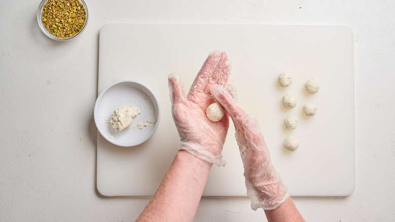 rolling goat cheese into balls