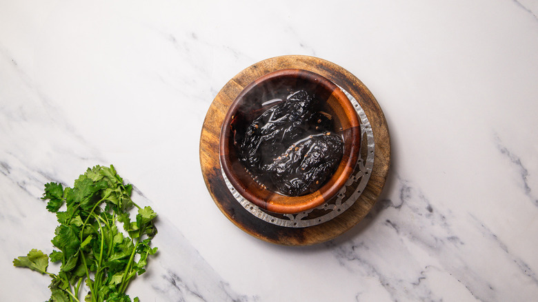 chiles in bowl with water