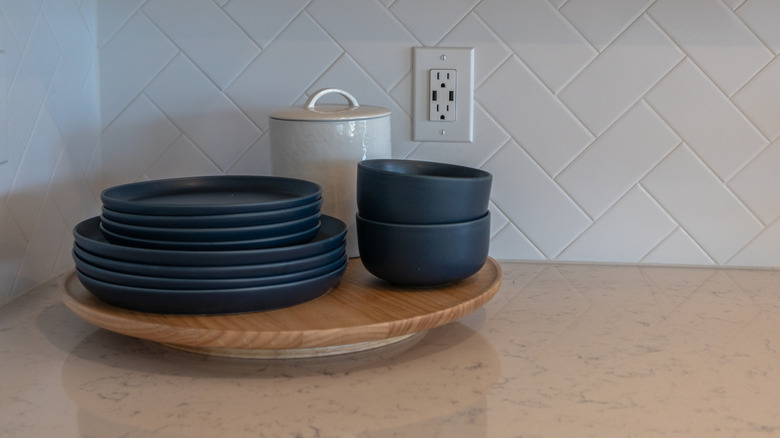Lazy Susan holding blue plates and bowls