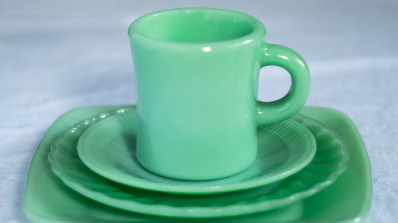 Jadeite mug on stacked plates