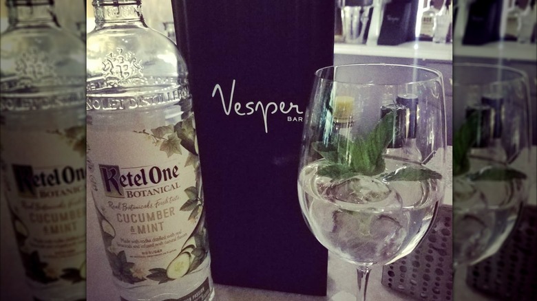 Ketel One bottle with cocktail and menu at Vesper Bar
