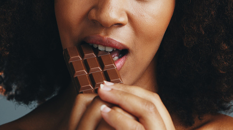 Close-up of a foodie eating a chocolate bear