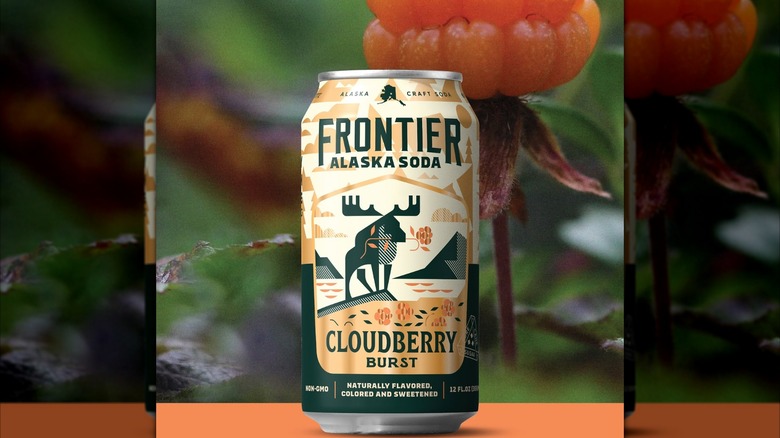 Can of Frontier Alaska Soda's Cloudberry Burst with a berry in the background