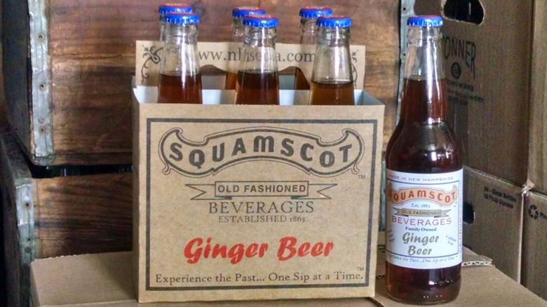 Case of six bottles of Squamscot ginger beer next to a bottle