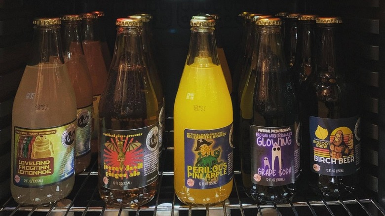 Five rows of bottles featuring different Cryptid Soda flavors