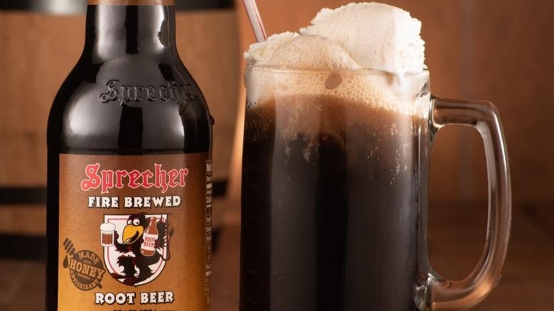 Bottle of Sprecher root beer beside a root beer float