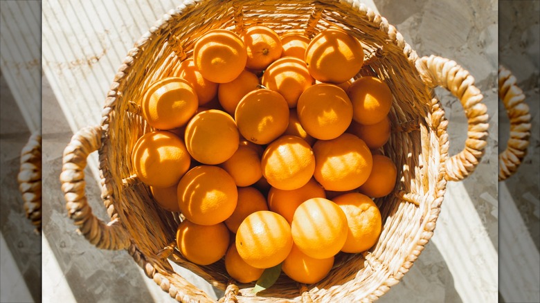 Wicker basket full of oranges