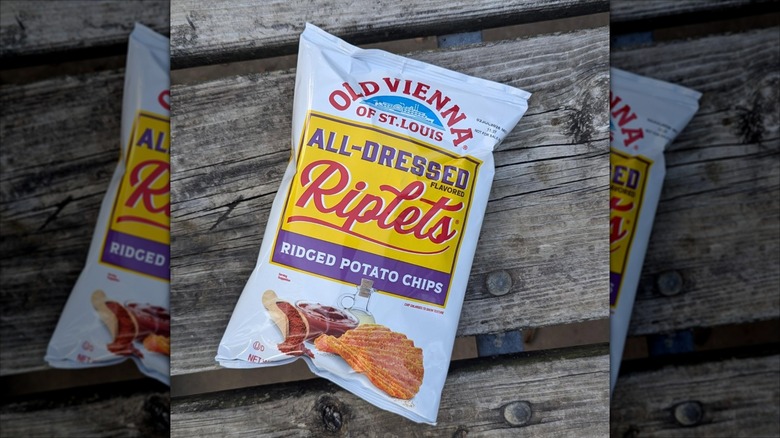 Bag of Red Hot Riplets chips on wooden table