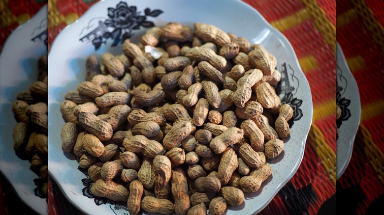 Pile of boiled peanuts on white plate