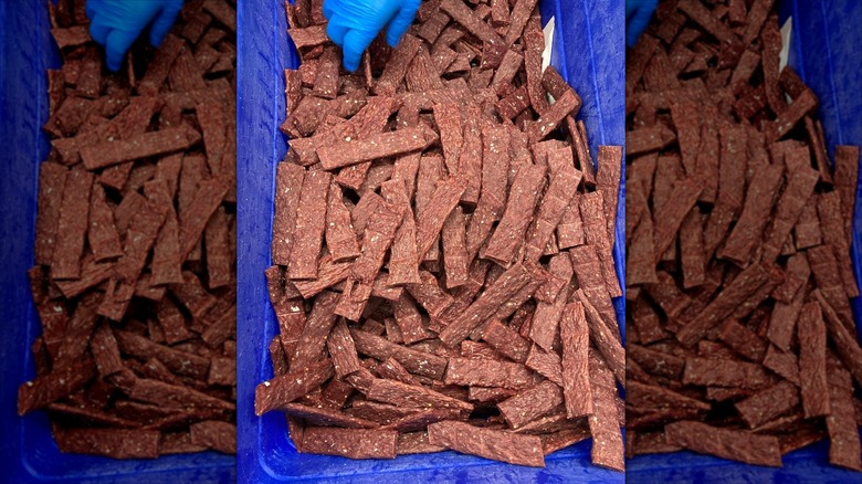 Pile of Wyoming jerky sticks in blue bin