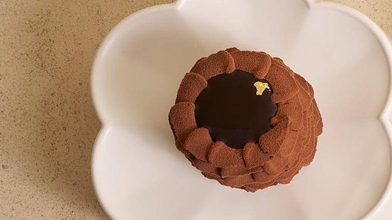 Lysée pastry shop very important chocolate cake on a white plate