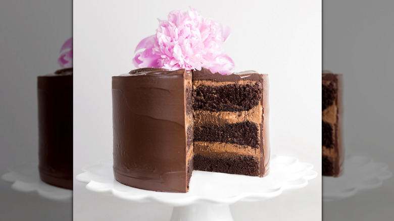 The Cake Bake Shop chocolate cake with flower garnish