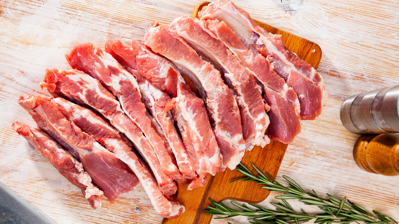 Fresh raw ribs herbs wood