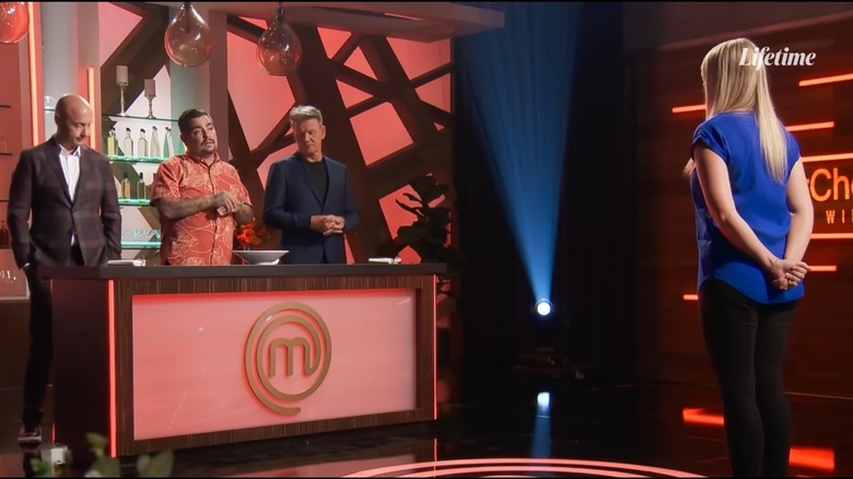 MasterChef judges with contestant on stage