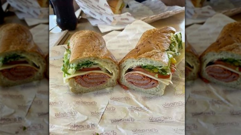 An Italian sandwich from D'Angelo sitting on a wrapper in the restauraunt
