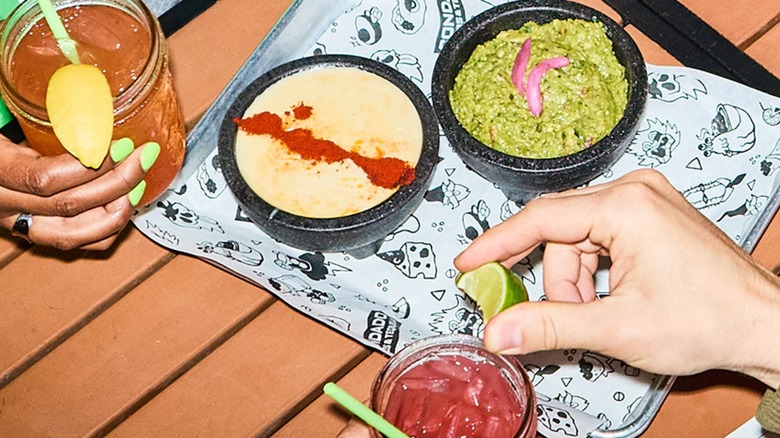 Margaritas, questo, and guacamole at Condado Tacos