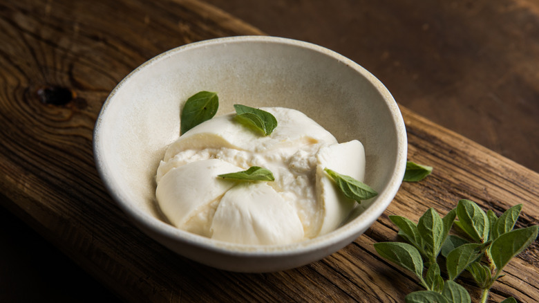 Bowl of burrata with fresh herbs