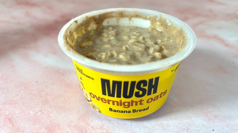 MUSH banana bread overnight oats on pink marble surface