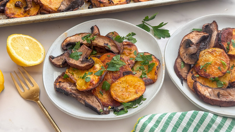 Mushroom potato bake servings on plates with parsley