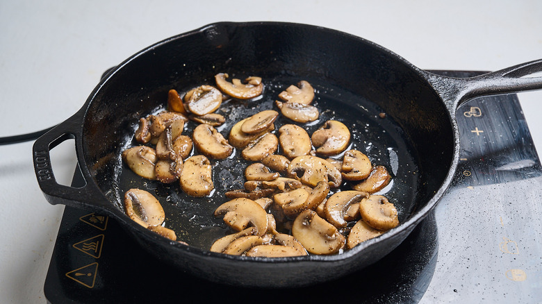cooking mushrooms in a skillet