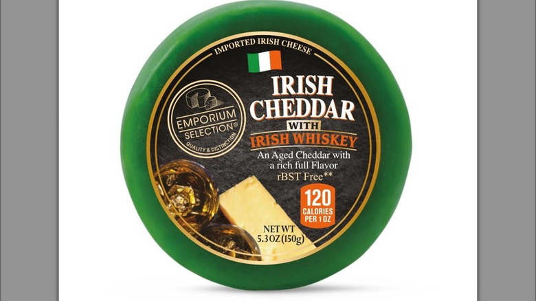 Round Irish Cheddar cheese in a green package