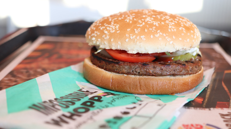 Burger King Whopper displayed on its packaging on a table