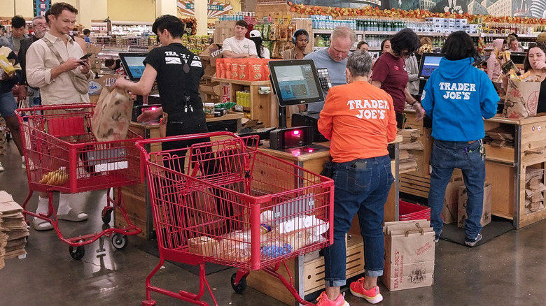 Trader Joe's employees bagging groceries