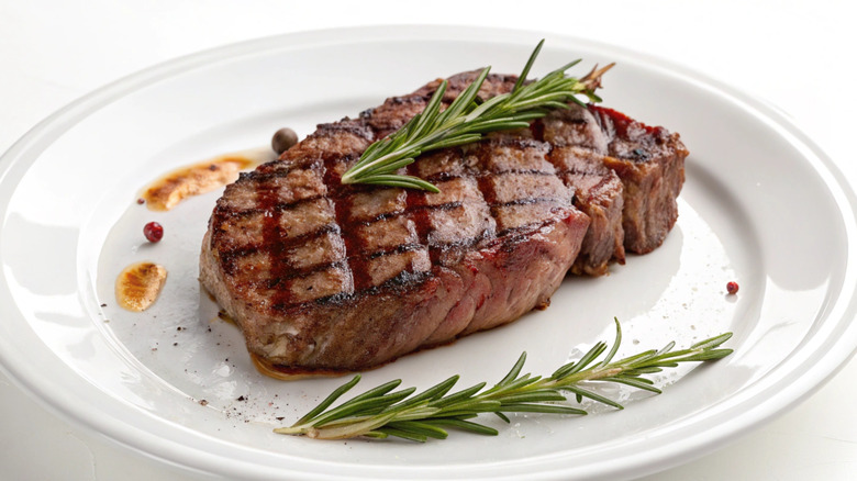 grilled ribeye steak on plate