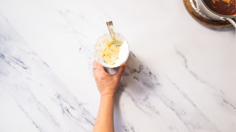 Cream cheese in standing blender container