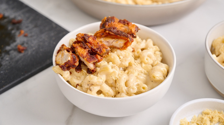 bowl of mac and cheese with Nashville hot chicken