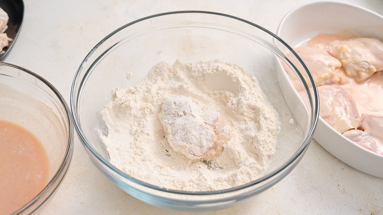 dredging chicken in flour