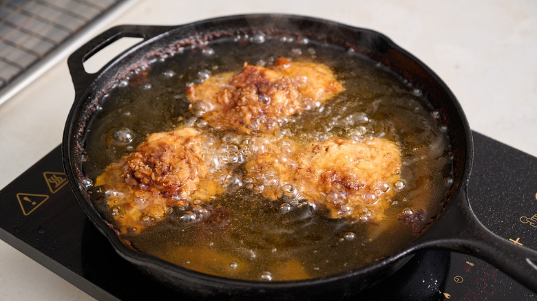 frying chicken in oil