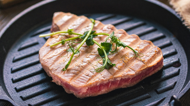 Pan-seared tuna steak in pan