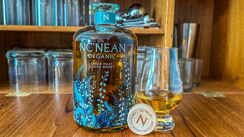 Nc'nean whisky with glass