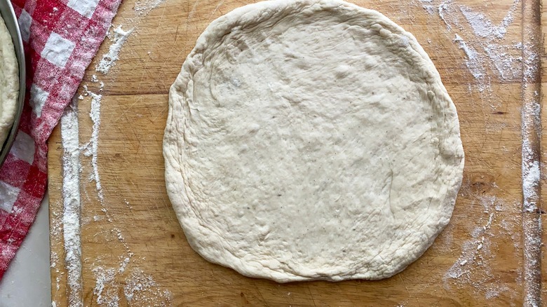 pizza dough on board