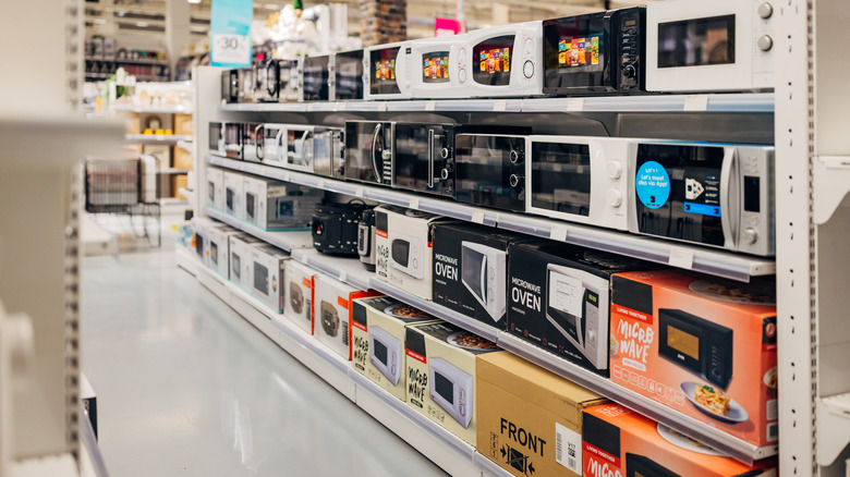Display of microwave ovens in a clean, well-lighted retail store
