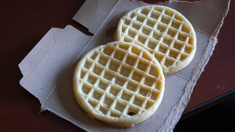 couple of frozen waffles on cardboard