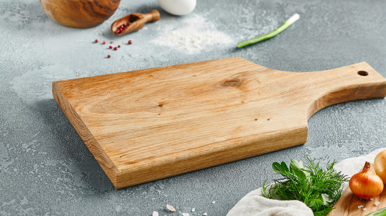 wooden cutting board with herbs