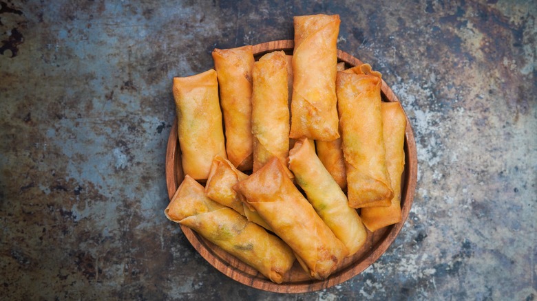 Bowl of fried Asian spring rolls