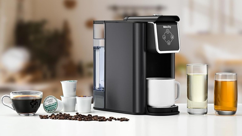 Black Mecity coffee machine in the center of the photo, flanked by various drinks.